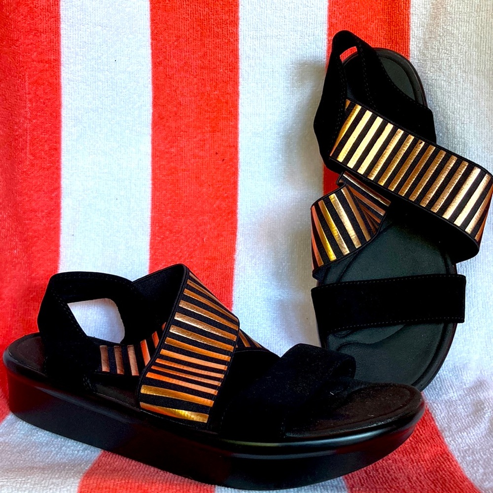 Sketcher’s Black and Copper Luxe Foam sandals